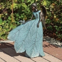 19.75" Angel With Leafy Skirt Playing With Bird Garden Statue
