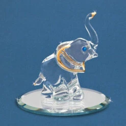 22Kt Gold Trimmed Elephant With Trunk Up And Blue Crystals Glass Figurine